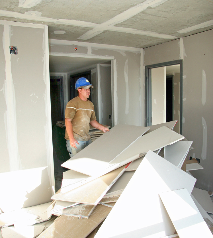 Contractor working with drywall